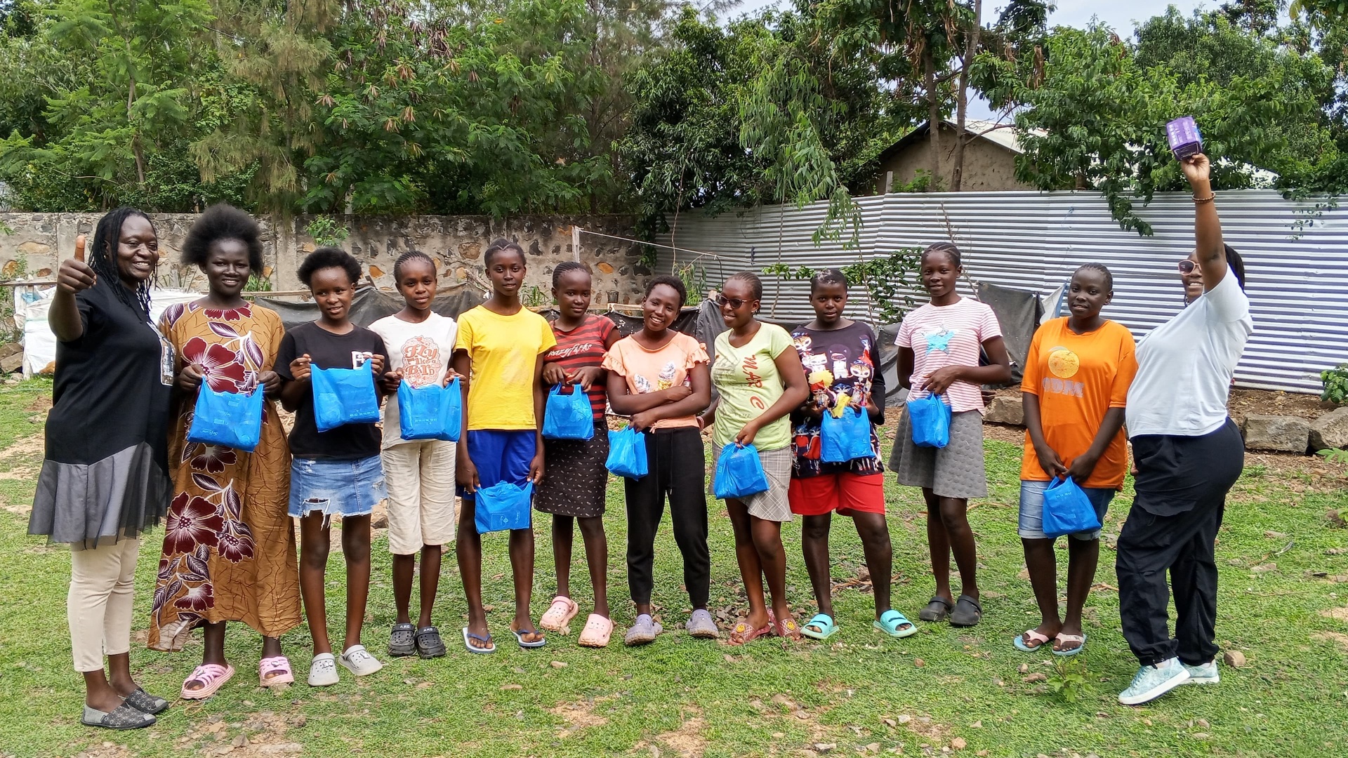 Girls receive dignity kits at an ARI community session in Kisumu